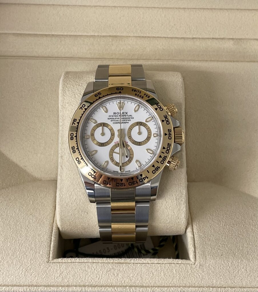 Two-tone steel and gold Rolex Cosmograph Daytona watch with white dial and three subdials