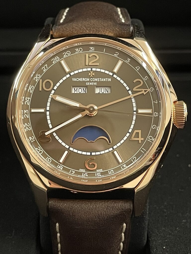 Vacheron Constantin rose gold watch with brown dial, day-date complication, and moonphase